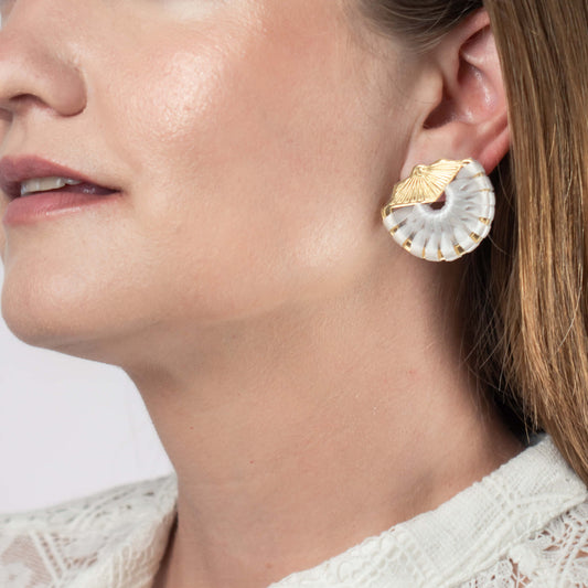 Model wearing shell bridal stud earrings