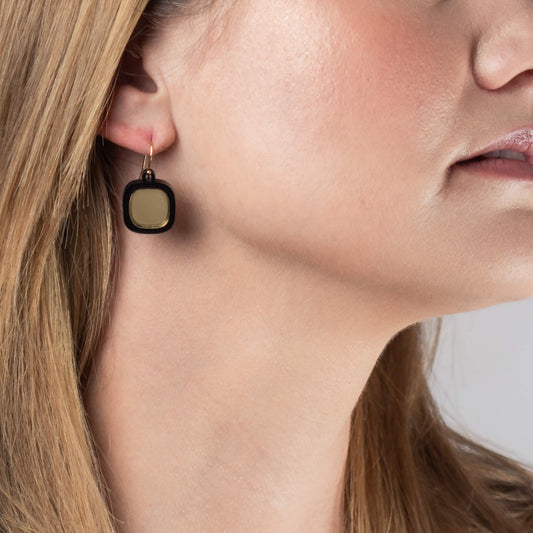 Model wearing mirror small wire earrings