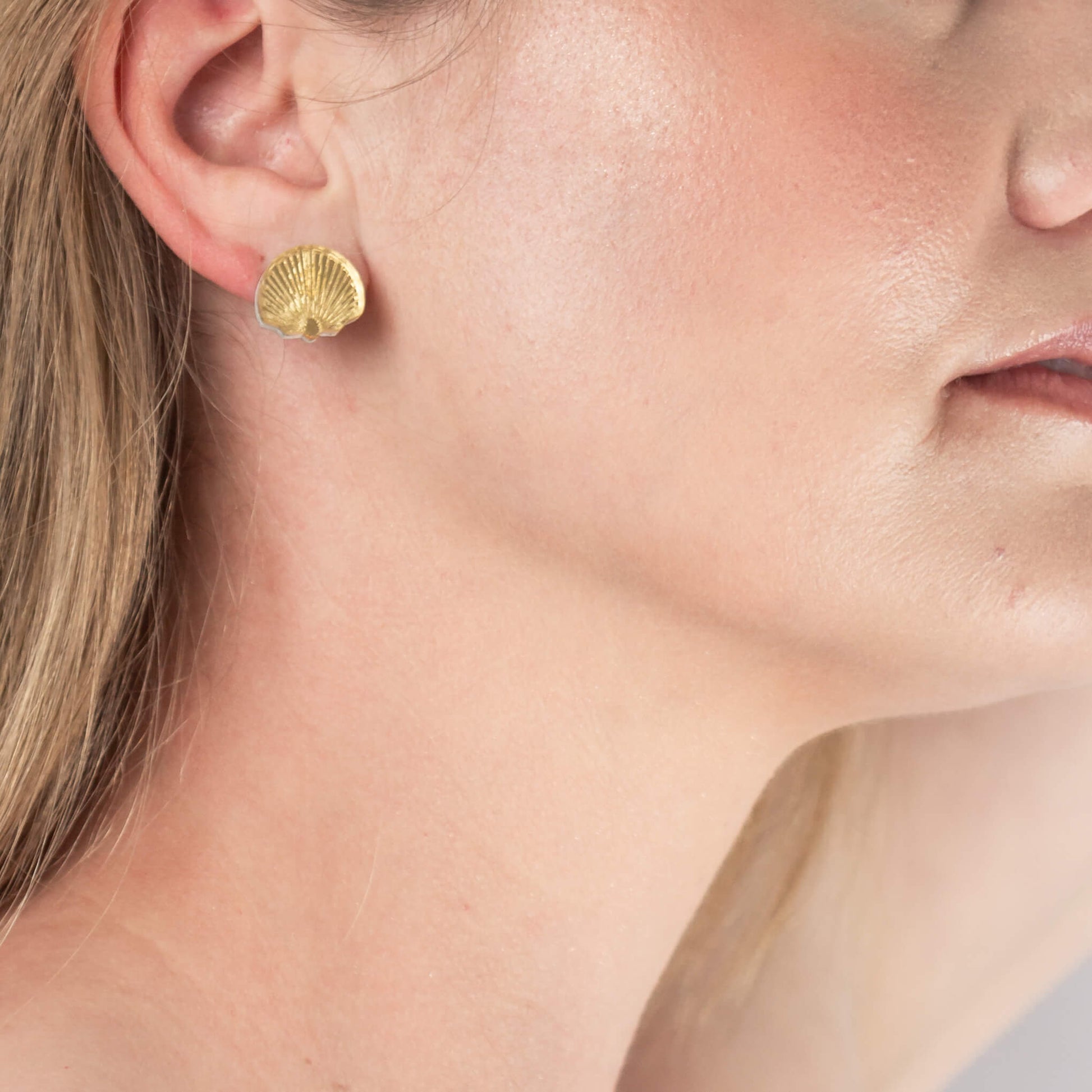 Model wearing shell bridesmaid earrings
