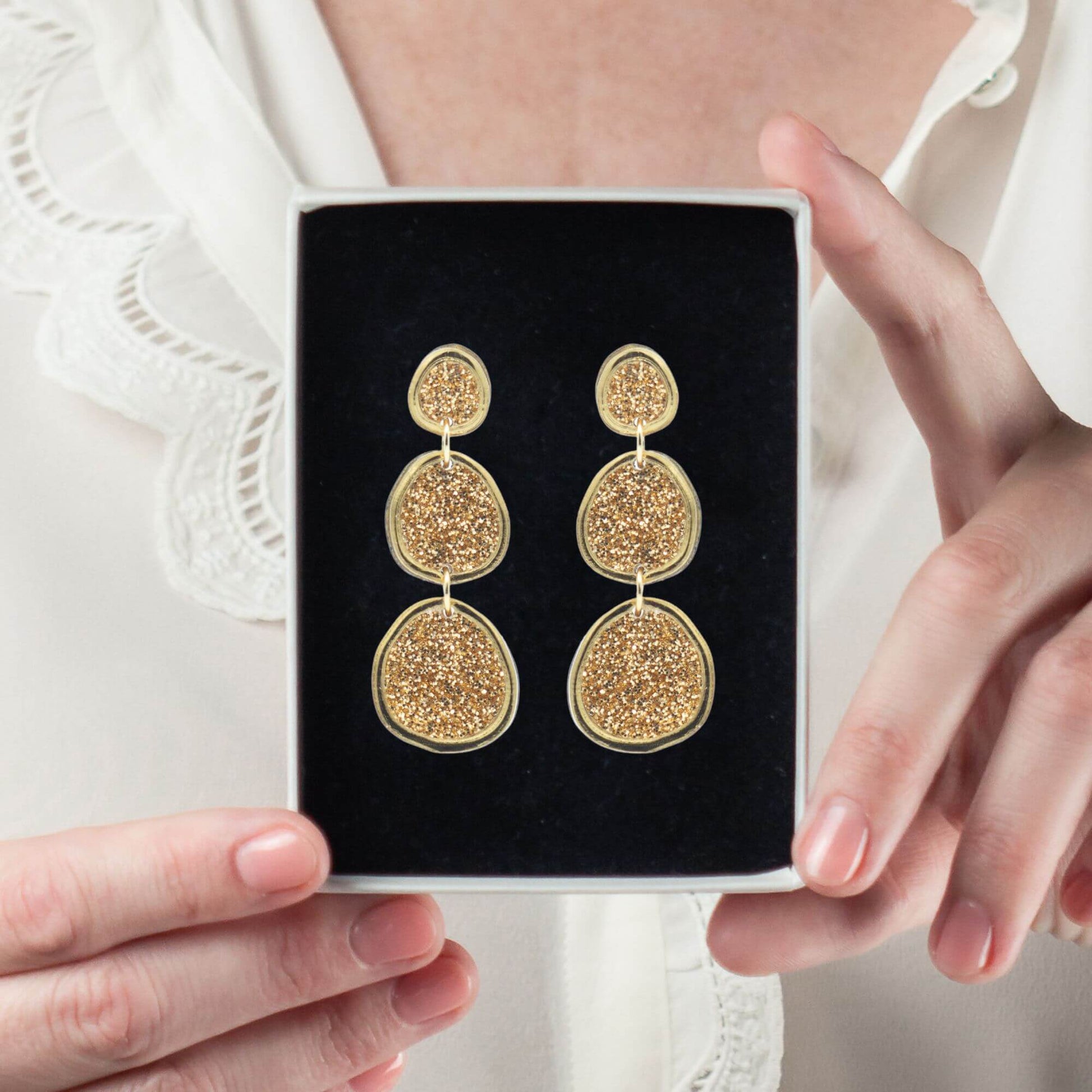 Shimmering gold statement earrings in gift box