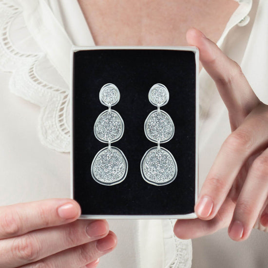 Shimmering silver statement earrings in gift box