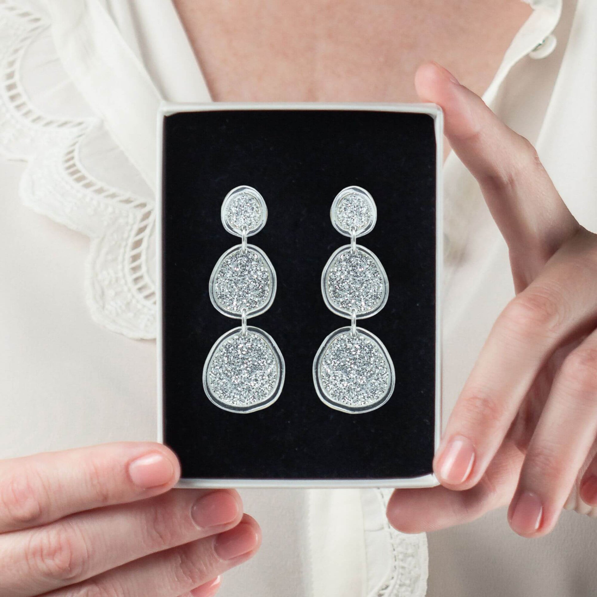 Shimmering silver statement earrings in gift box