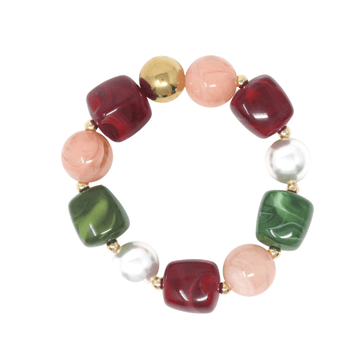 A beaded stretch bracelet featuring marbled square beads in deep red and forest green, smooth round beads in light pink, white pearl beads, and one polished gold bead, separated by small gold spacers on a white background.